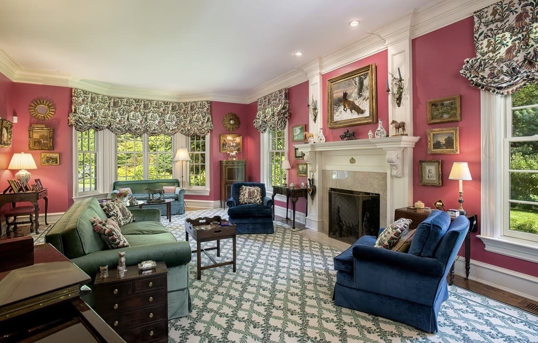 Furnished living room with dated brown upholstered furniture and a patterned rug.